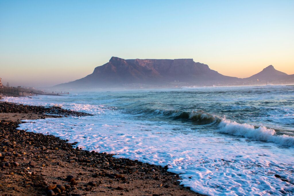 Table Mountain and ocean sunset from Blouberg Beach Cape Town