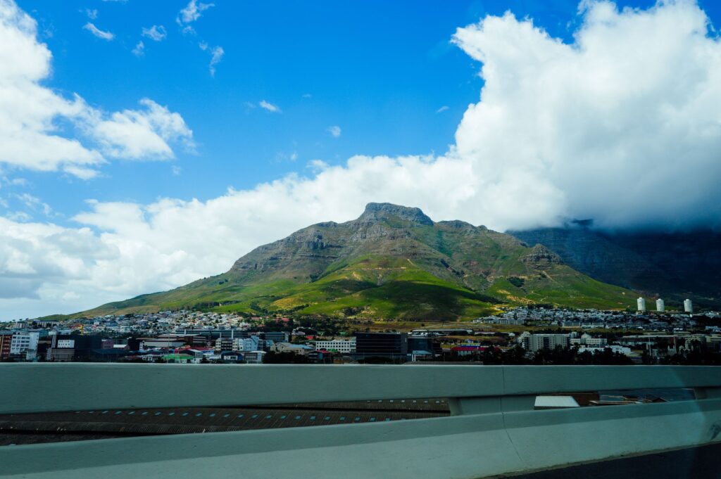 Table Mountain rising over Cape Town under a bright blue sky