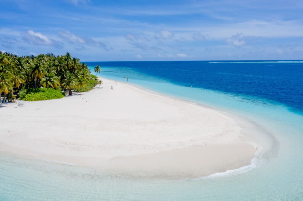 White sand beach and clear turquoise lagoon